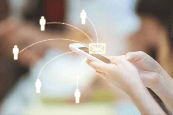 woman-using-smartphone-sending-message-from-e-mail-other-people-with-network